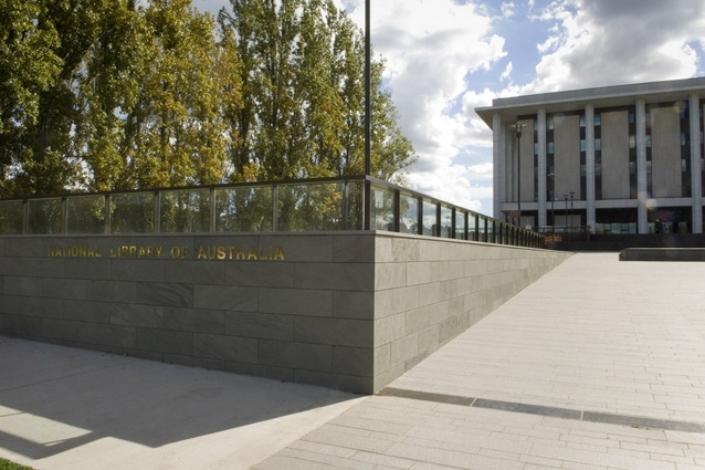 The refurbished NLA forecourt showing new walling and balustrade, and paved tilted plane which accentuates the verticality of the NLA facade on approach.