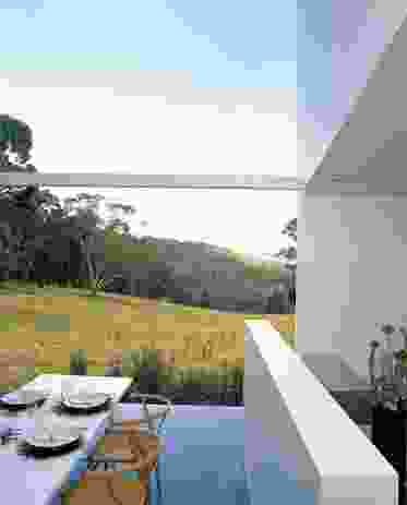 The house is sited in a clearing in the bush, capturing a gun-barrel view to the dam and landscape.