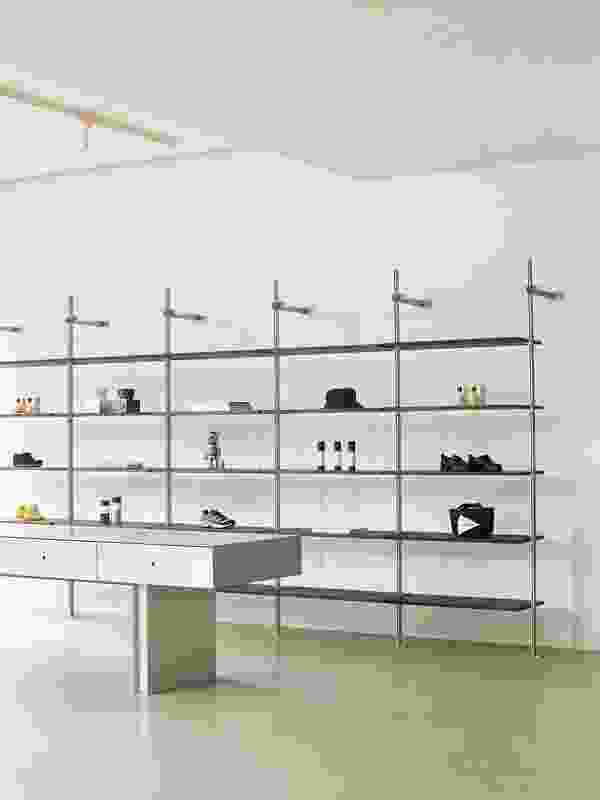 Uniquely assembled shelving acts as a backdrop to help define each area.