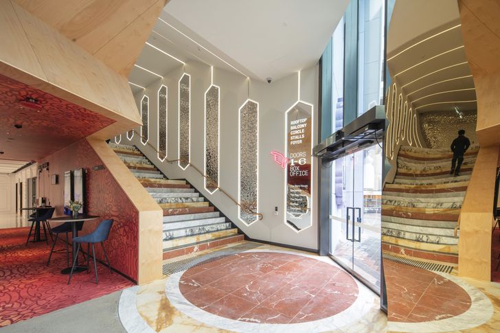 The marble staircase to the main foyer is inspired by Italian architect Gio Ponti.