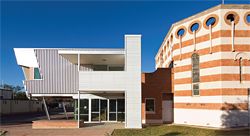 The entrance to the church at the eastern corner of the building is finished in two types of Colorbond cladding.