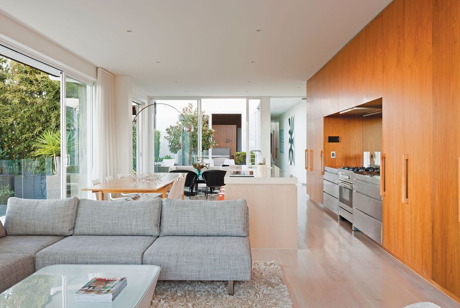 Large, sliding glass panels open up the living space to the central courtyard.