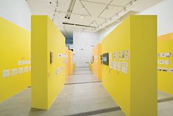 The aisles of yellow, “like oversized yellow trace”, form the backdrop for the sketches and notes of Lab Architecture Studio at the Ian Potter Centre, NGV.