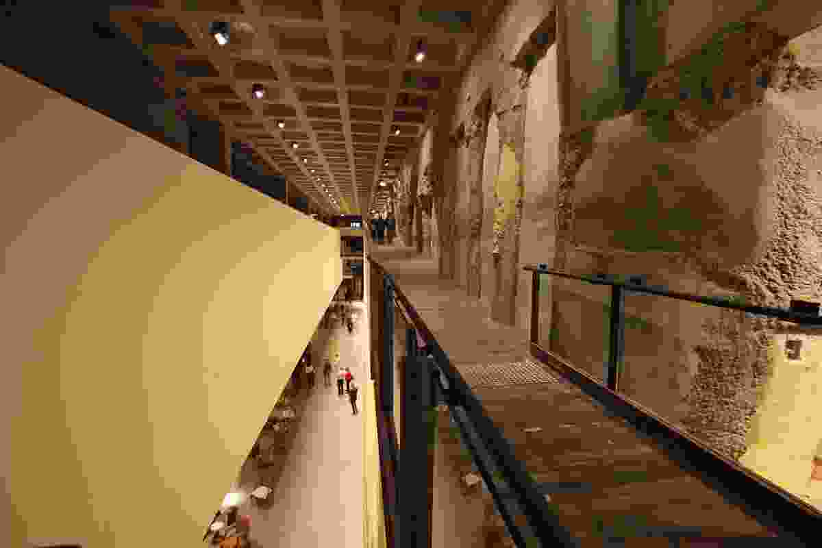 A walkway on level B1 peers through a void to the lower levels.