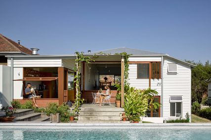 Interior spaces are redefined alongside terraces, courts and gardens, resulting in a warm and unpretentious home.