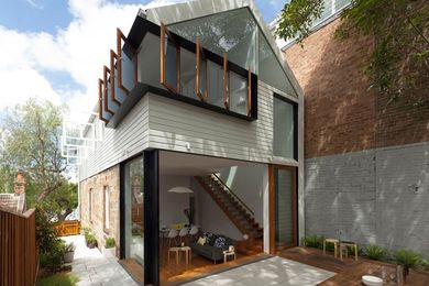 The main bedroom overhangs the combined kitchen/living space below.