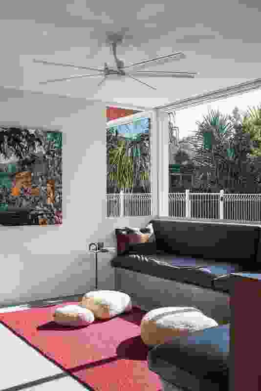 A sunken living room looks east toward the downsized pool. Artwork: Anita West.