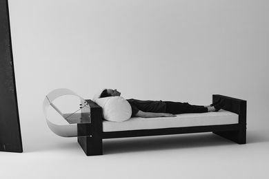 Olivia Bossy reclining on her No. 0422 daybed.