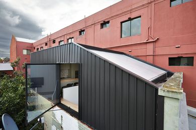 The upper level of Edwards Moore's terrace house opens up to views over rooftops and leafy streets.