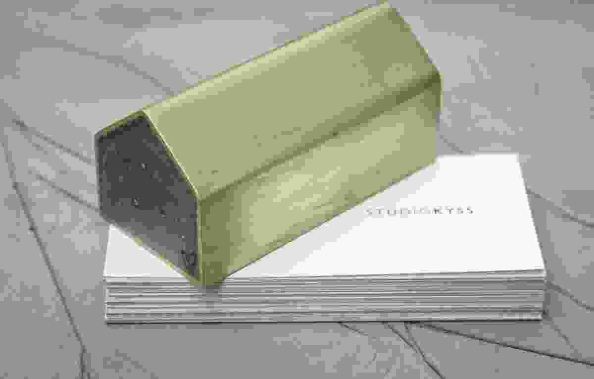 Concrete House Paperweight – a solid concrete block encased in copper or brass.