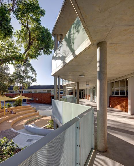 Existing red-brick facades were retained and punctuated with glass doors that open onto the new covered verandah.