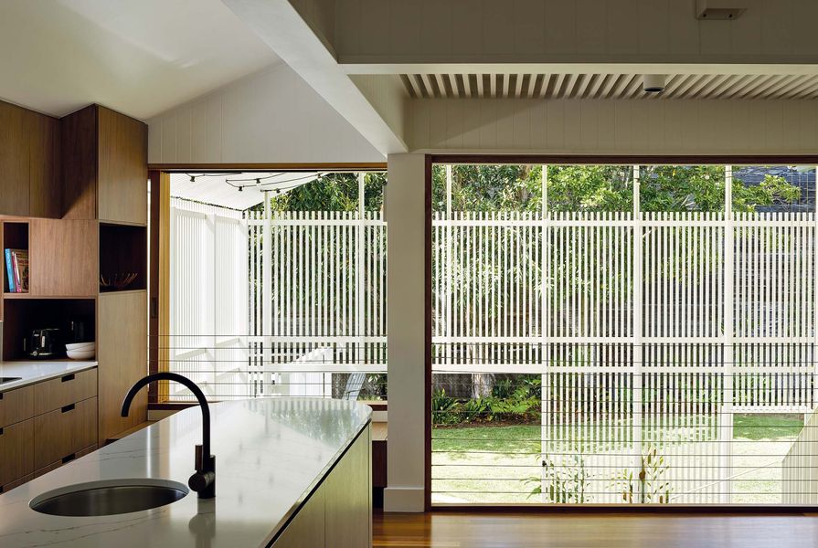 An openable wall draws light and air from the outdoor room into living spaces.