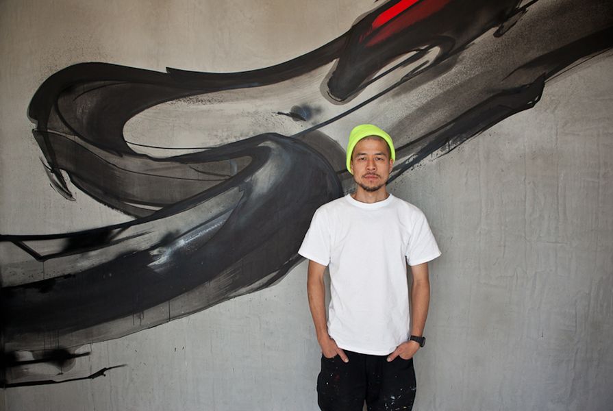 Graffiti artist Jun Inoue with his installation at Melbourne’s new Trocadero brasserie.