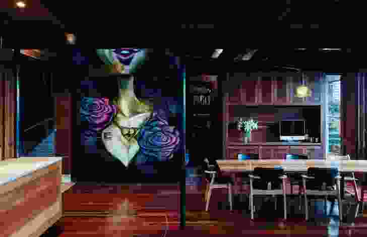 A large-scale mural by prominent street artist Sofles is featured in the dining area, adding a punch of vibrancy.