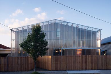 View of the northern facade. A screen of transparent polycarbonate encloses verandah spaces on the northern and western edges.