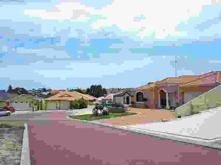 A street scene in Spearwood, Perth, Western Australia. Note the extensive paved areas, few windows and dominance of wide garages.