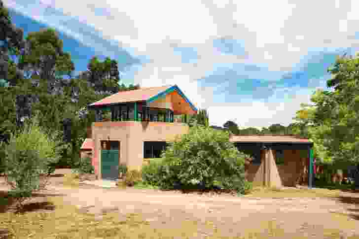 A hexagonal turret with a strangely simple gable roof forms the main entry to the complex.