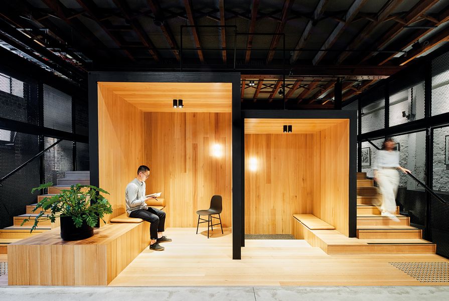 At ground floor, an informal meeting space with timber pods encourages collaboration.