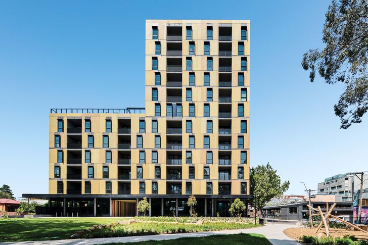A palette of stained finishes that reference the surrounding residential context are applied to the facades, bringing a patina that softens the precast concrete buildings.