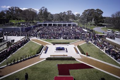 The symmetrical courtyard consists of levelled seating, paving and grass, leading to  the memorial fountain.