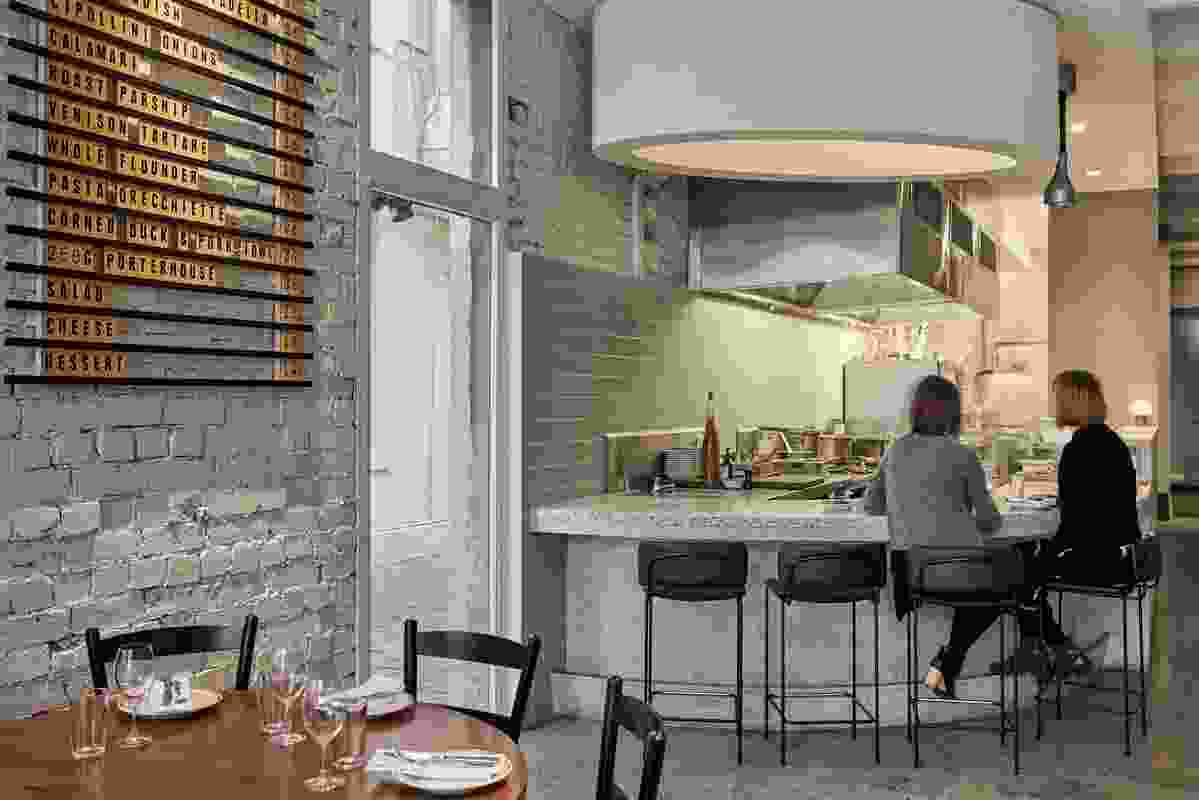The wine bar spans two shopfronts and offers diverse options for sitting, standing and leaning.