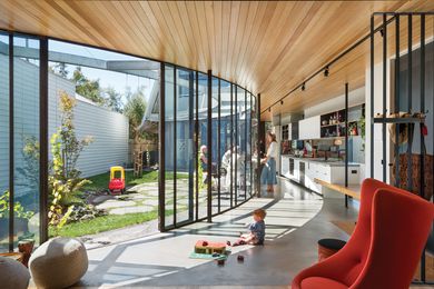 The expressive curve serves the practical purpose of delineating space while retaining familial connections.