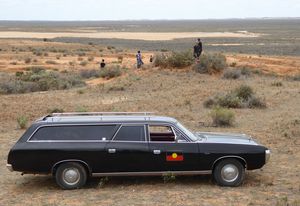 Mungo Man’s remains arrived home in a 1976 black Chrysler Valiant hearse.