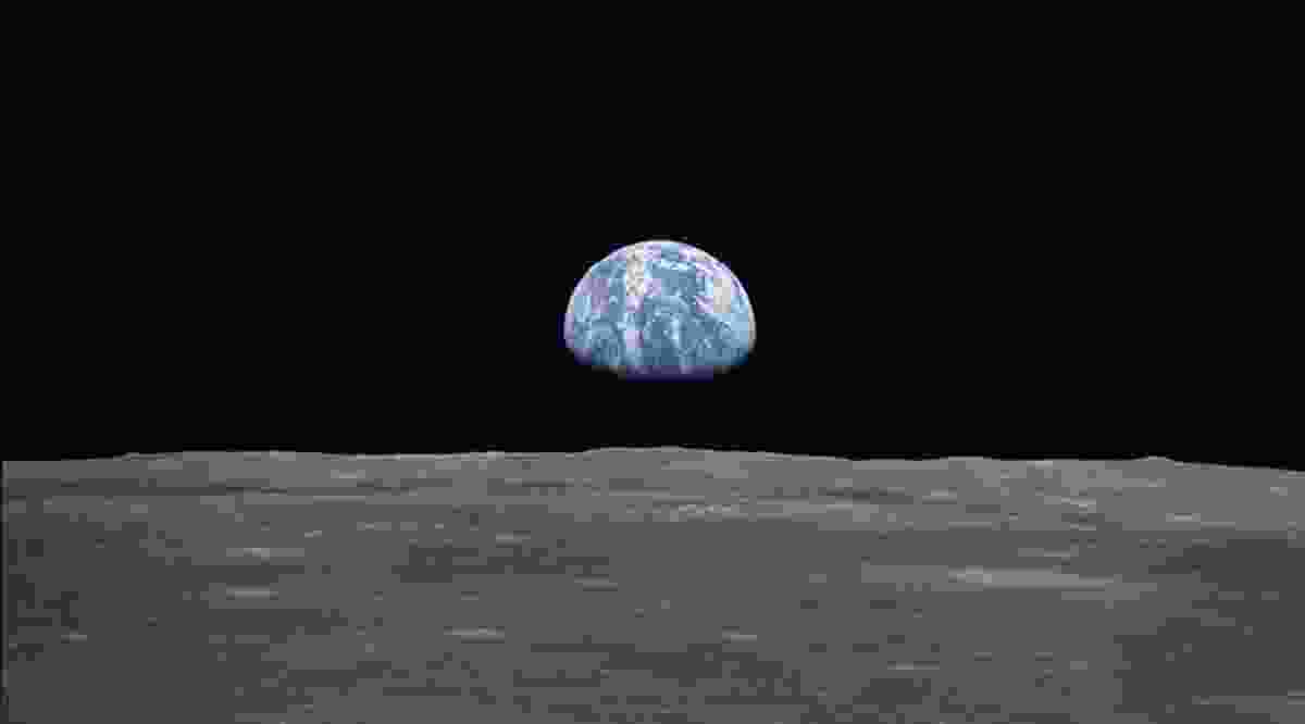 View from the Apollo 11 spacecraft taken on 20 July 1969 showing the Earth rising above the moon’s horizon.