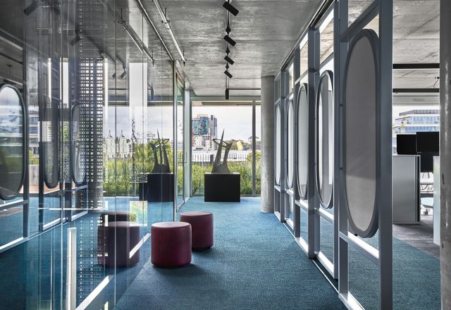 Teal carpets and full-height glazing are equal parts serene and stimulating.