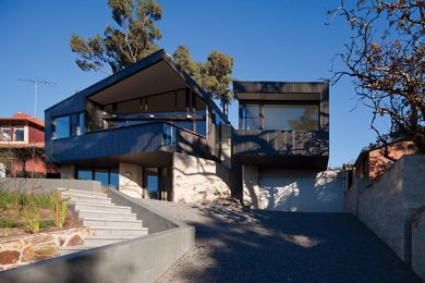 The two upper wings of the house split off from each other.