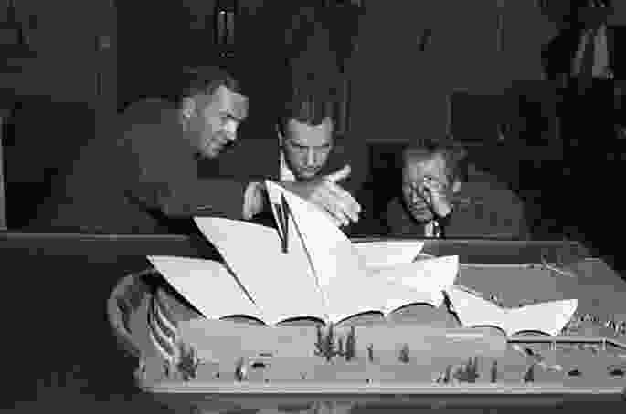 Jørn Utzon (left) presenting a model of the Opera House at Sydney Town Hall, 1957.