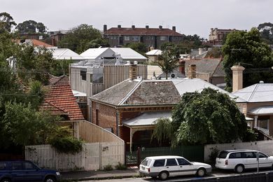 The Webb House in its St Kilda context, showing a range of active sustainable technology on the roof.