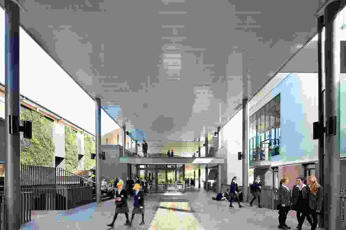 An external thoroughfare with central cafe form a new social hub for the school.