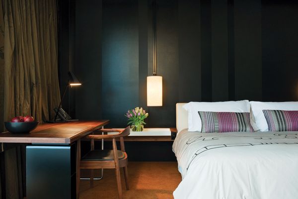 Hotel bedrooms are moody and contemporary with individually selected touches.