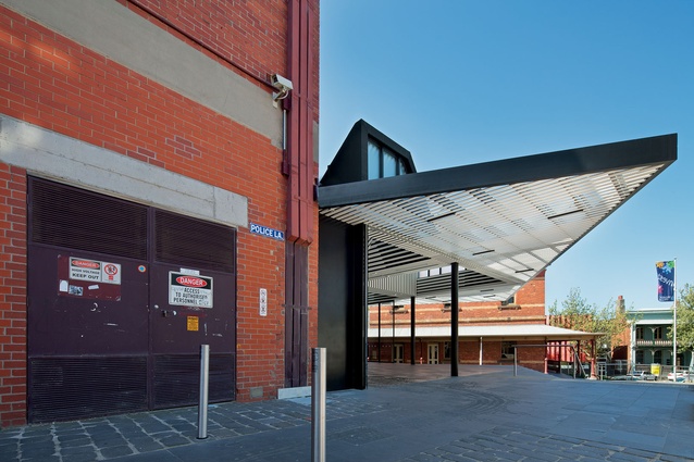 The annexe sits in a back-of-house context, facing an underused plaza.