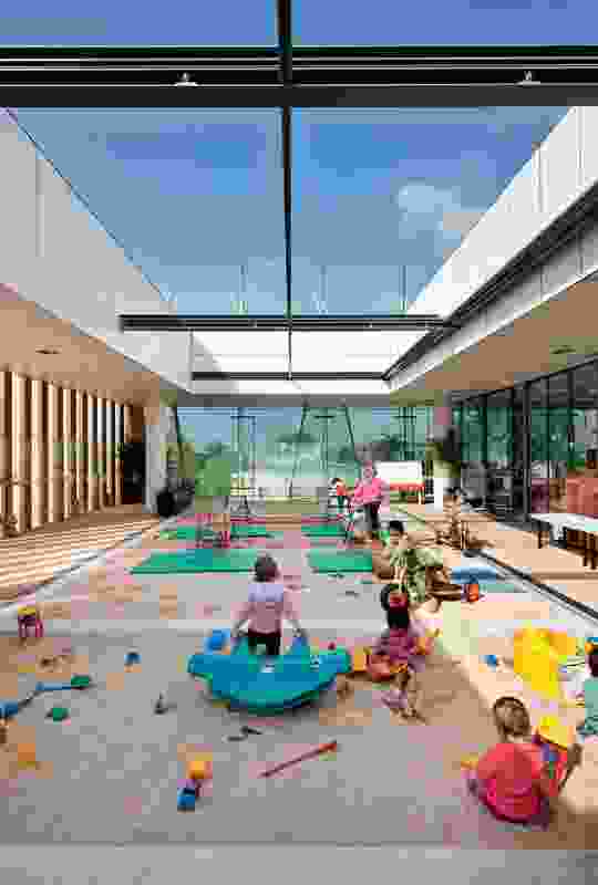 The childcare centre on level 2 includes an open-air play area.