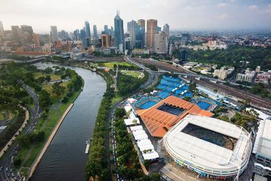 The copper-coloured roof of Margaret Court Arena contrasts with the white steel roofs of the arena’s sports architecture neighbours.