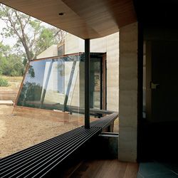 The internal/external steel window seat splays and
folds from an external porch/pod into the study.