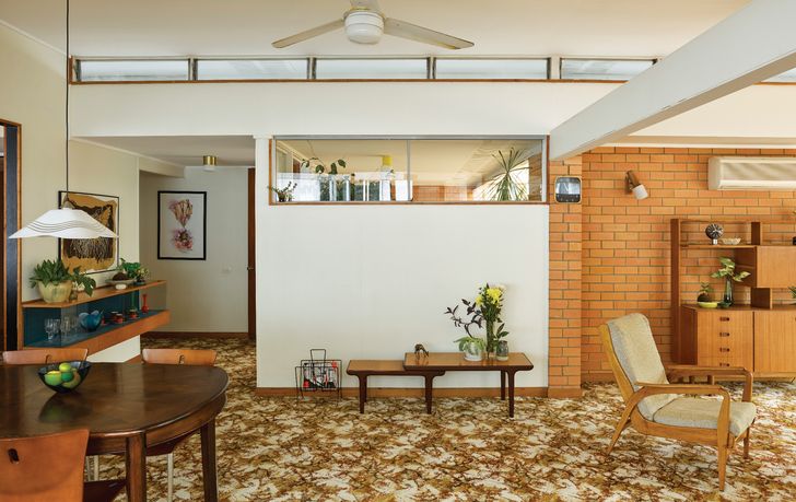 Primary windows protected by wide overhangs and cleverly conceived clerestory windows let in an even wash of light.