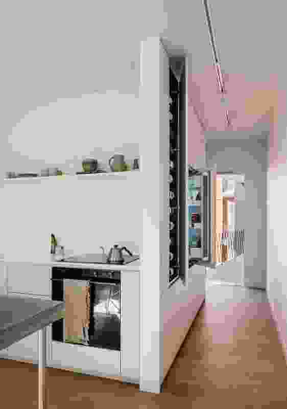 The pantry and refrigerator are now discreetly concealed around the corner from the kitchen.
