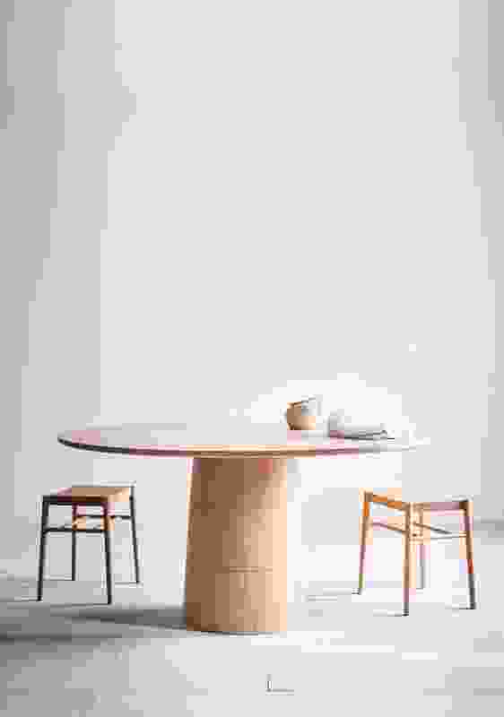 The Rodan dining table is grounded by a solid base that champions the inherent material qualities of timber.