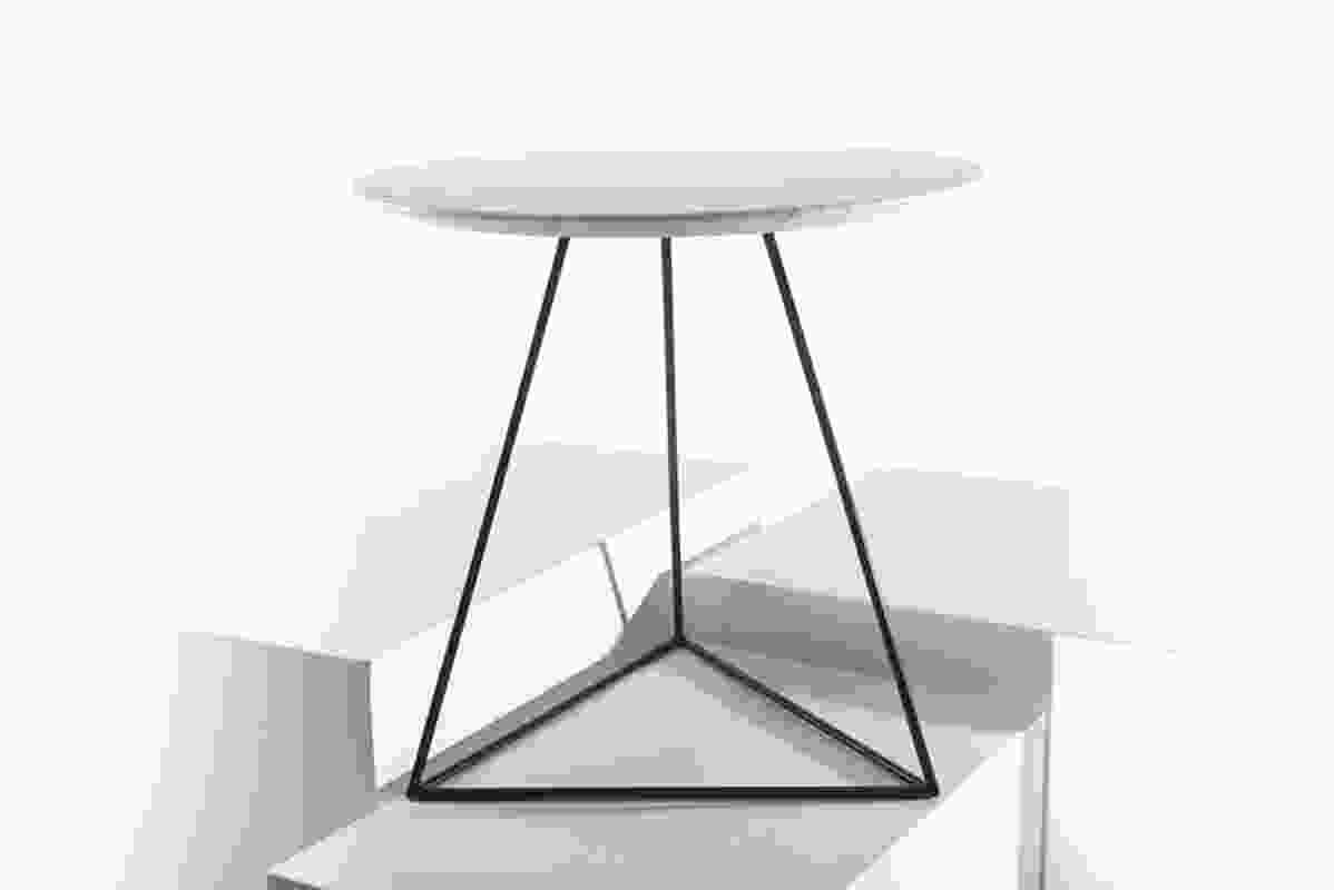 The GEO side table with a shark-nosed marble top.