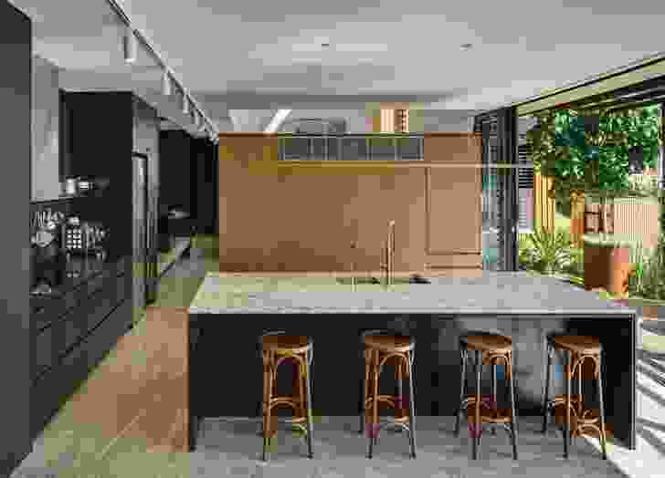 The kitchen and dining areas are oriented to exploit the views and seamlessly connect with the garden.