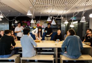 Staff and students share morning tea together in the University of Queensland's School of Architecture, recently renovated by m3architecture.