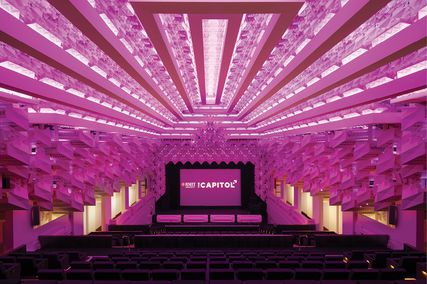 The vast plaster ceiling features copiously repeated prismatic forms, housing lights that can be varied in colour and intensity.