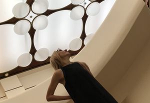 Virginia admires the detail in the translucent modulated ceiling of Frank Lloyd Wright's V.C. Morris Gift Store.