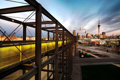 The gantry at dusk looking back to the city. Large colourful buoys at the base of the structure will eventually form part of a new playground.