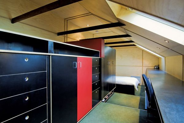 Roof Retreat – Formply joinery containing a cache of wardrobe items forms the ordered storage for the bedroom.