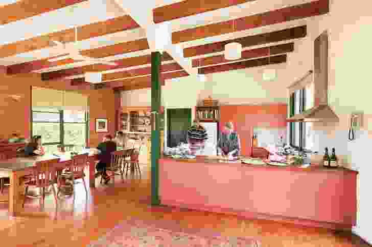 A farmhouse-scale kitchen area provides a welcome space for coming together and sharing meals. Artwork: Juliana Hilton.