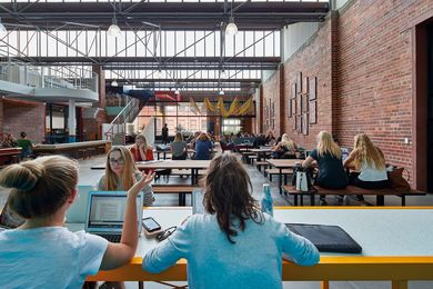 The student hub’s internal face brick walls are topped with a sawtooth roof that provides great natural light.